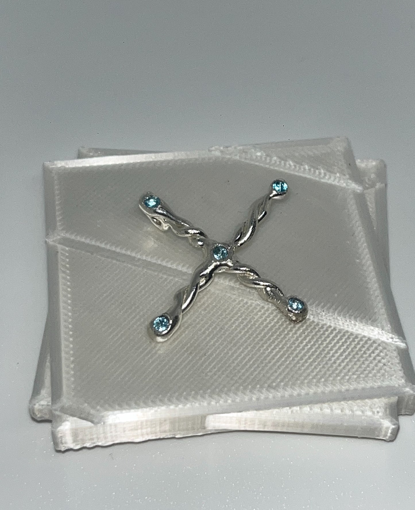 Cross pendant with blue sky topaz