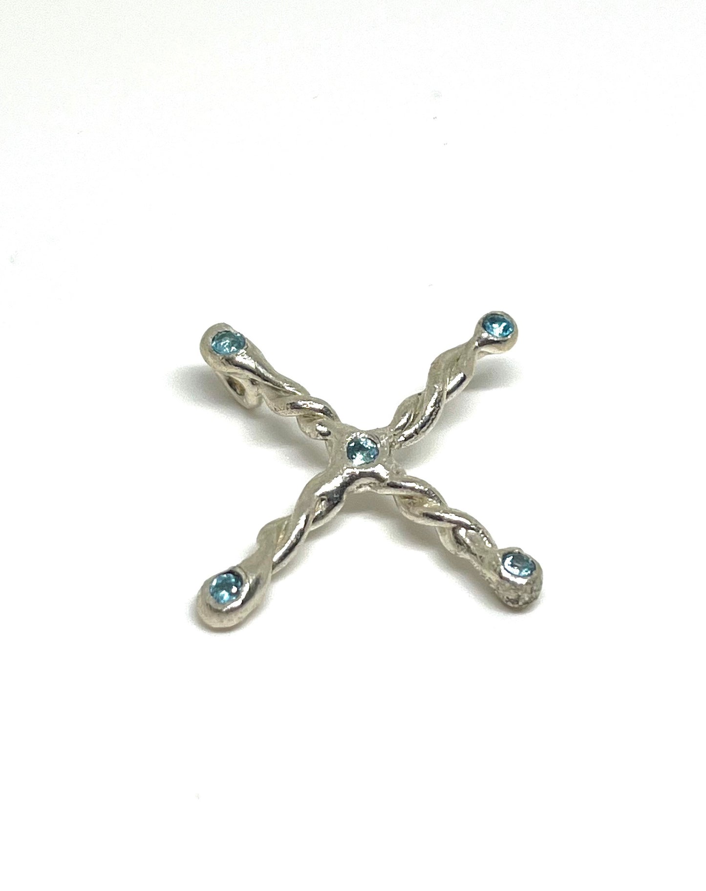 Cross pendant with blue sky topaz