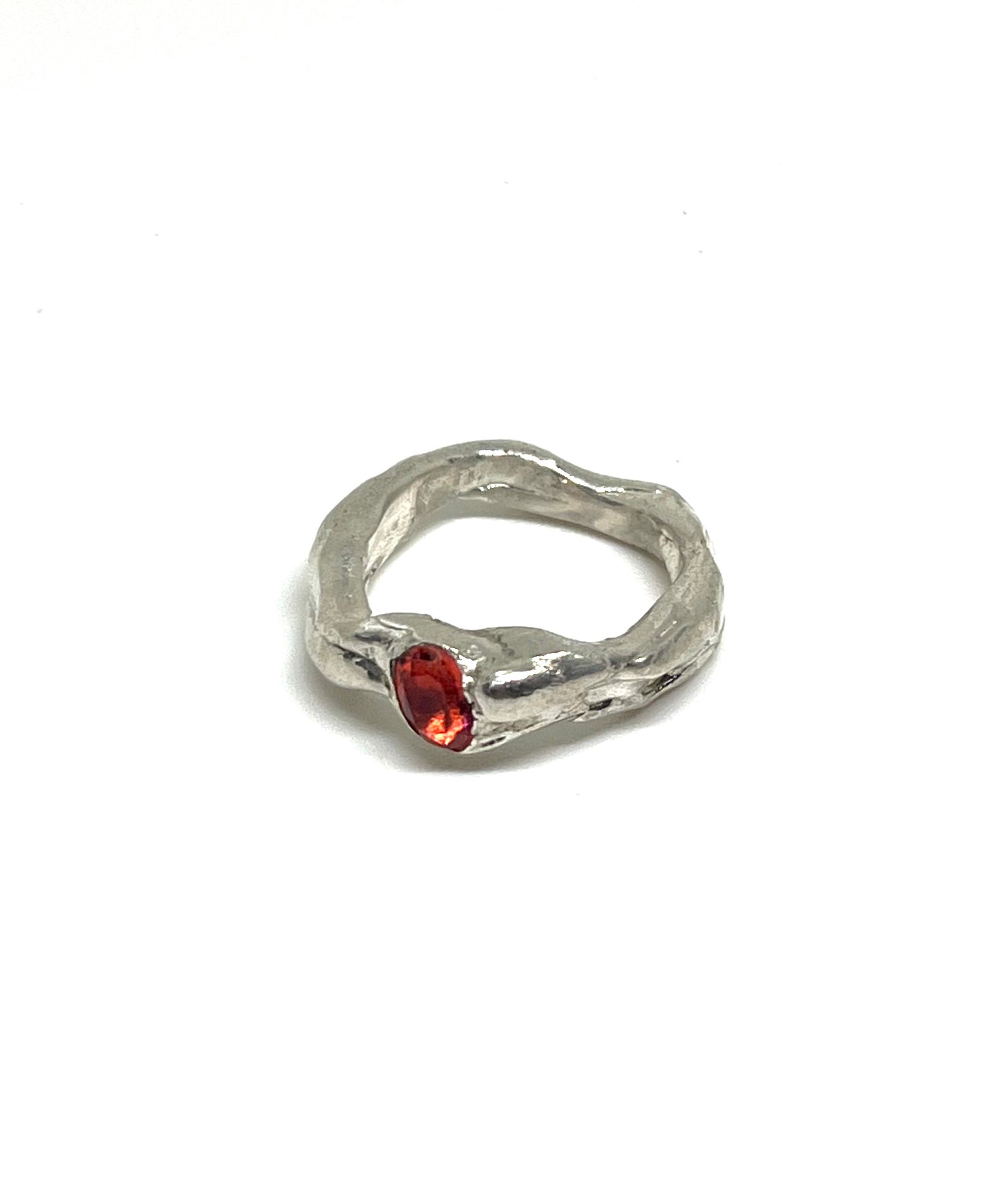 Abstract ring with red topaz